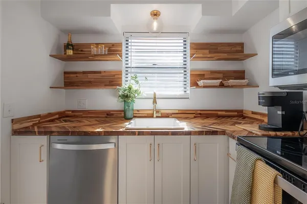 a view of a house with backyard porch and sitting area