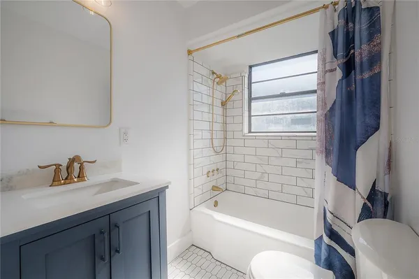 a view of a patio with a table and chairs