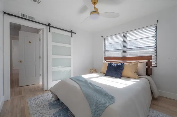 a view of a patio with table and chairs a barbeque grill with potted plants