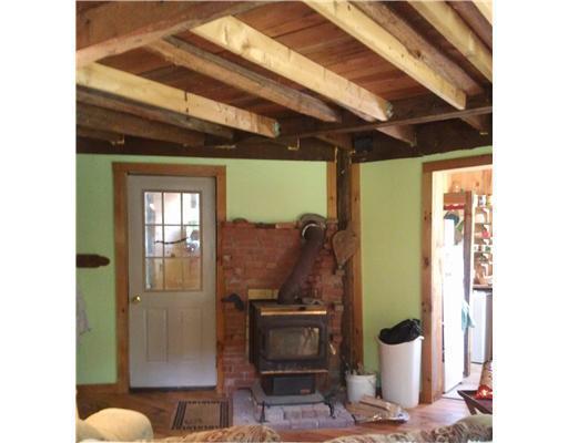 58 Smith Road Newport, ME 04953 - Photo 21 of 25 Living Room. Wood stove to keep you...