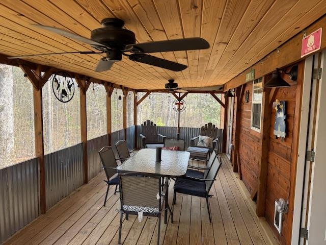 535 Big Springs Road Medon, TN 38356 - Photo 12 of 15 Wooden deck with outdoor dining space and ceiling fan
