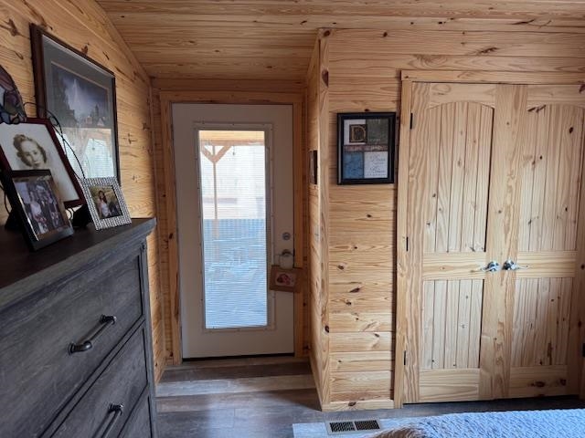 535 Big Springs Road Medon, TN 38356 - Photo 13 of 15 Doorway with wooden ceiling, wooden walls, and wood finished floors