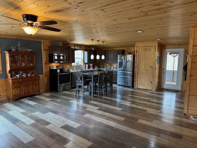 535 Big Springs Road Medon, TN 38356 - Photo 2 of 15 Kitchen featuring stainless steel appliances, decorative light fixtures, wooden ceiling, dark wood-style floors, and dark wood finish cabinets
