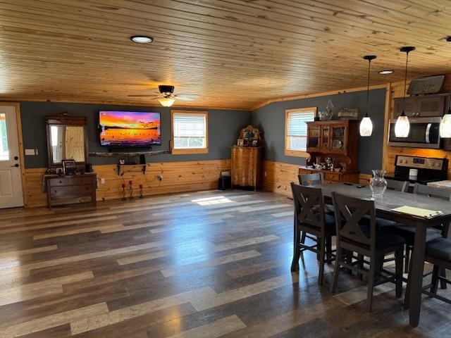 535 Big Springs Road Medon, TN 38356 - Photo 3 of 15 Dining room with wainscoting, wooden walls, a ceiling fan, dark wood-style flooring, and wood ceiling
