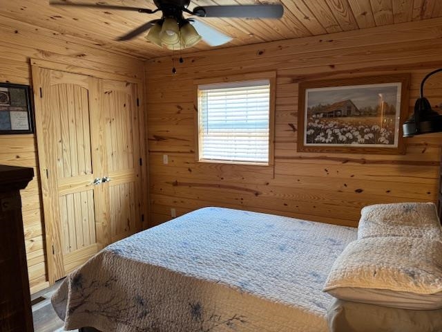 535 Big Springs Road Medon, TN 38356 - Photo 7 of 15 Bedroom featuring wooden walls, ceiling fan, and wood ceiling
