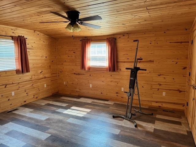 535 Big Springs Road Medon, TN 38356 - Photo 8 of 15 Exercise area with wood walls, ceiling fan, dark wood-style flooring, and wooden ceiling