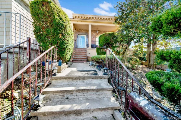 a view of a house with wooden stairs