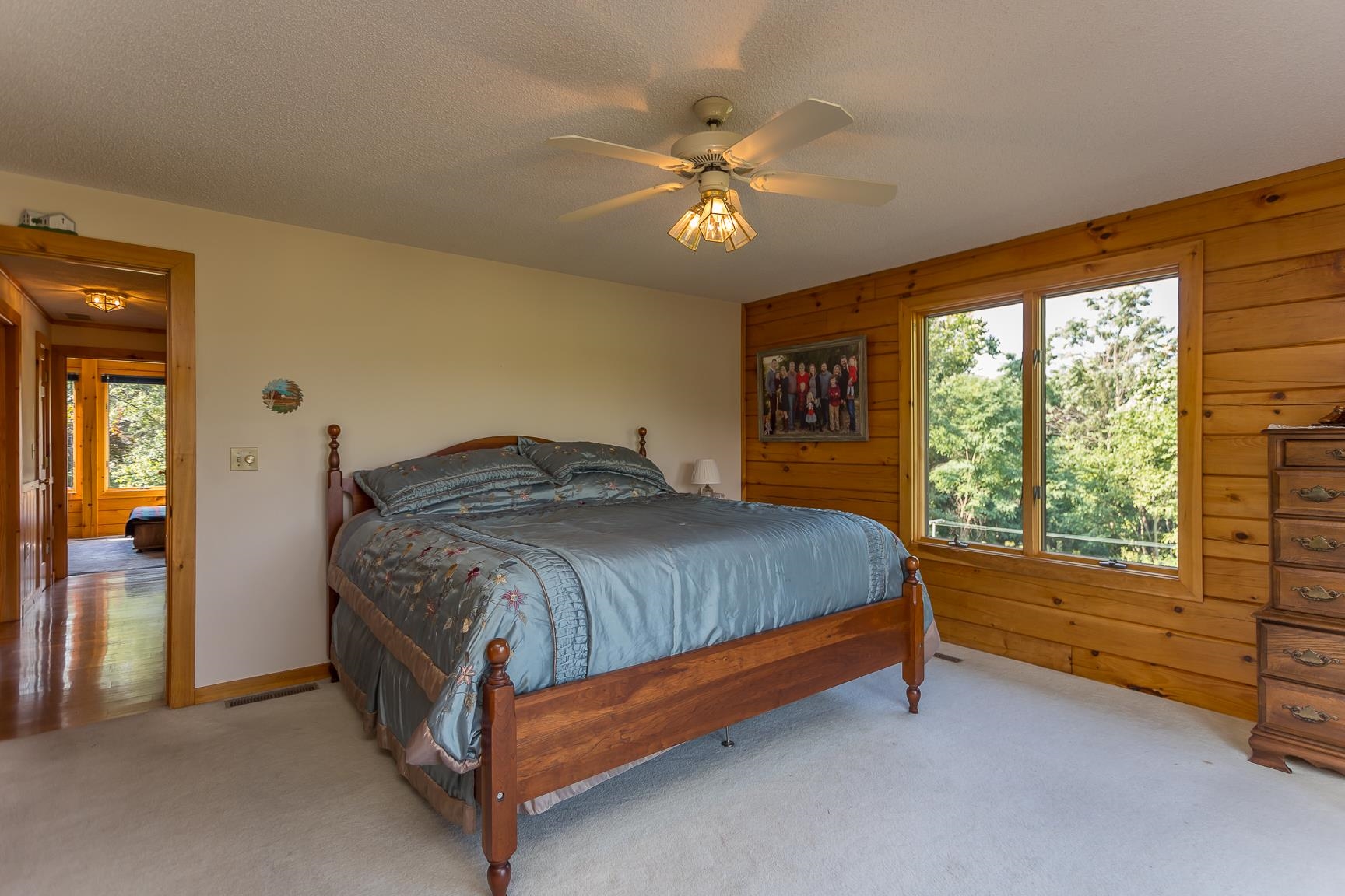 1003 Natural Chimney Road Mount Solon, VA 22843 - Photo 18 of 73 a bedroom with a bed and a chandelier