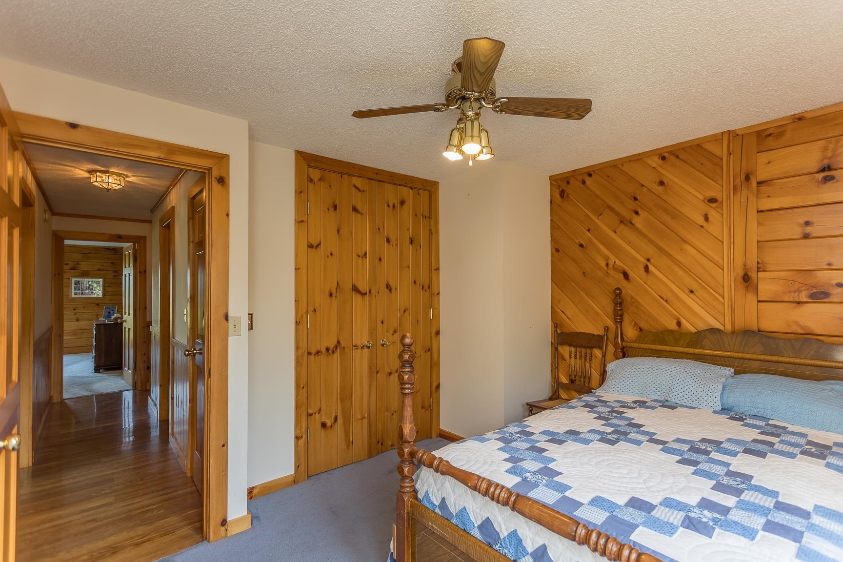 1003 Natural Chimney Road Mount Solon, VA 22843 - Photo 36 of 73 a bedroom with a bed and a chandelier