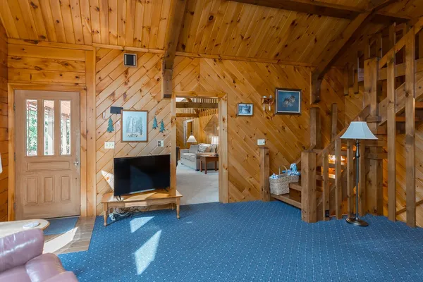 a view of a balcony with floor to ceiling window and outdoor kitchen
