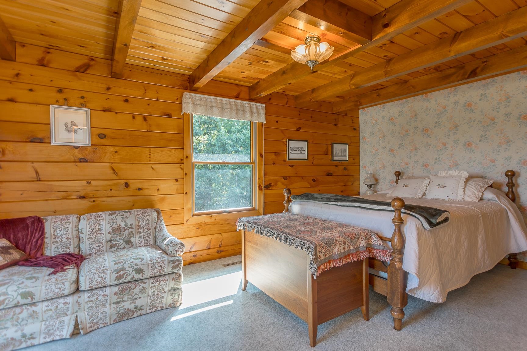 1003 Natural Chimney Road Mount Solon, VA 22843 - Photo 57 of 73 a bed room with a bed and a couch