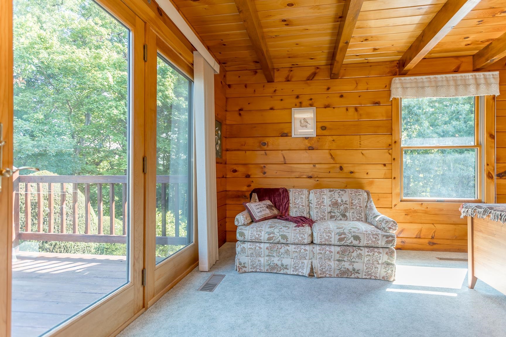 1003 Natural Chimney Road Mount Solon, VA 22843 - Photo 58 of 73 a living room with fireplace furniture and a floor to ceiling window