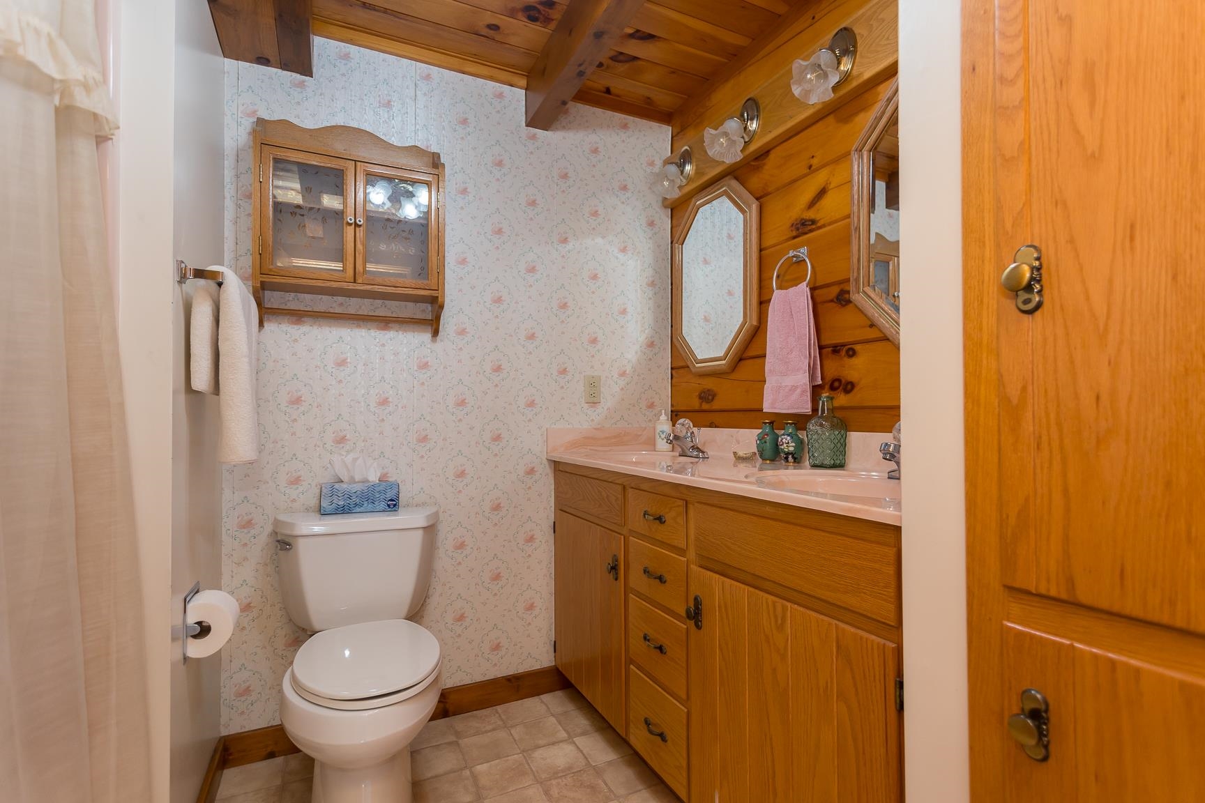 1003 Natural Chimney Road Mount Solon, VA 22843 - Photo 59 of 73 a bathroom with a granite countertop toilet sink and mirror
