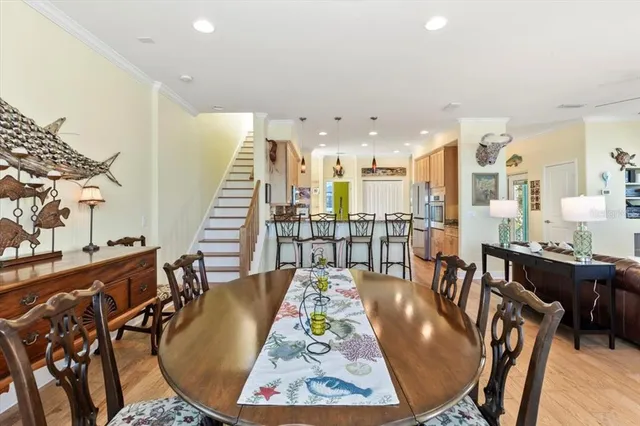 a kitchen with a refrigerator and a stove top oven