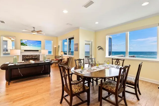 a view of living room with furniture and wooden floor