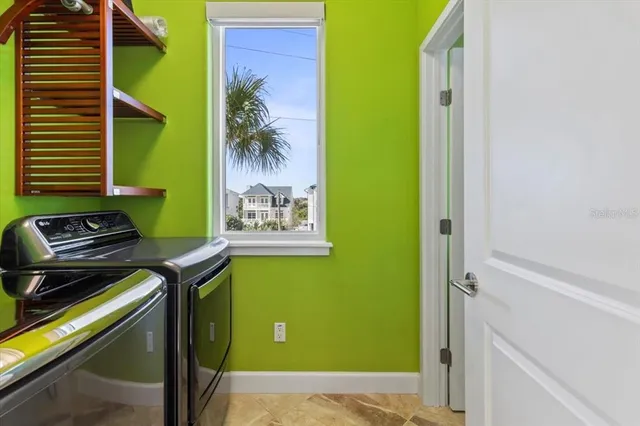 a bedroom with a bed and a flat tv screen on dresser