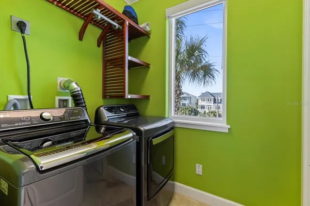 a bedroom with a bed and a lamp on wall