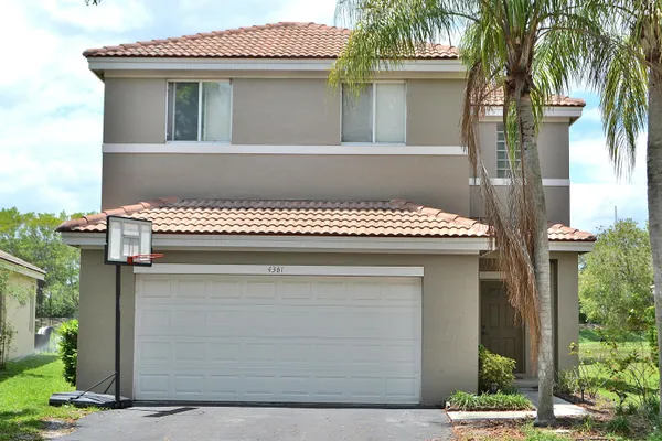 a front view of a house with a garage