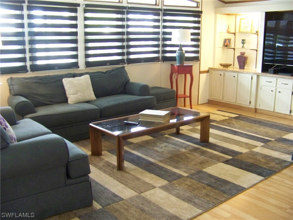 15550 Burnt Store Road, Unit 51 Punta Gorda, FL 33955 - Photo 11 of 50 a living room with furniture and a window