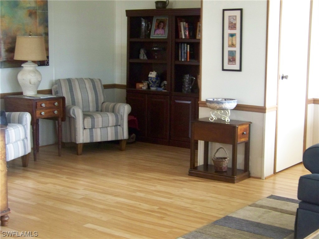 15550 Burnt Store Road, Unit 51 Punta Gorda, FL 33955 - Photo 14 of 50 a living room with furniture and a fireplace