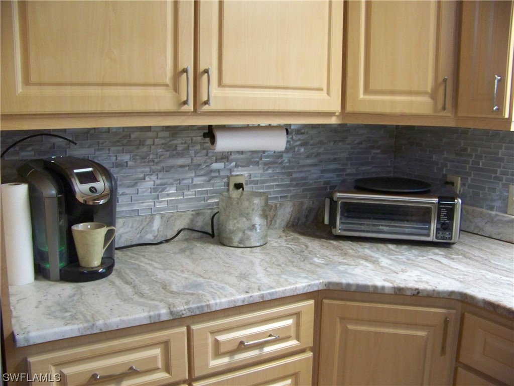 15550 Burnt Store Road, Unit 51 Punta Gorda, FL 33955 - Photo 18 of 50 a kitchen with a sink and cabinets