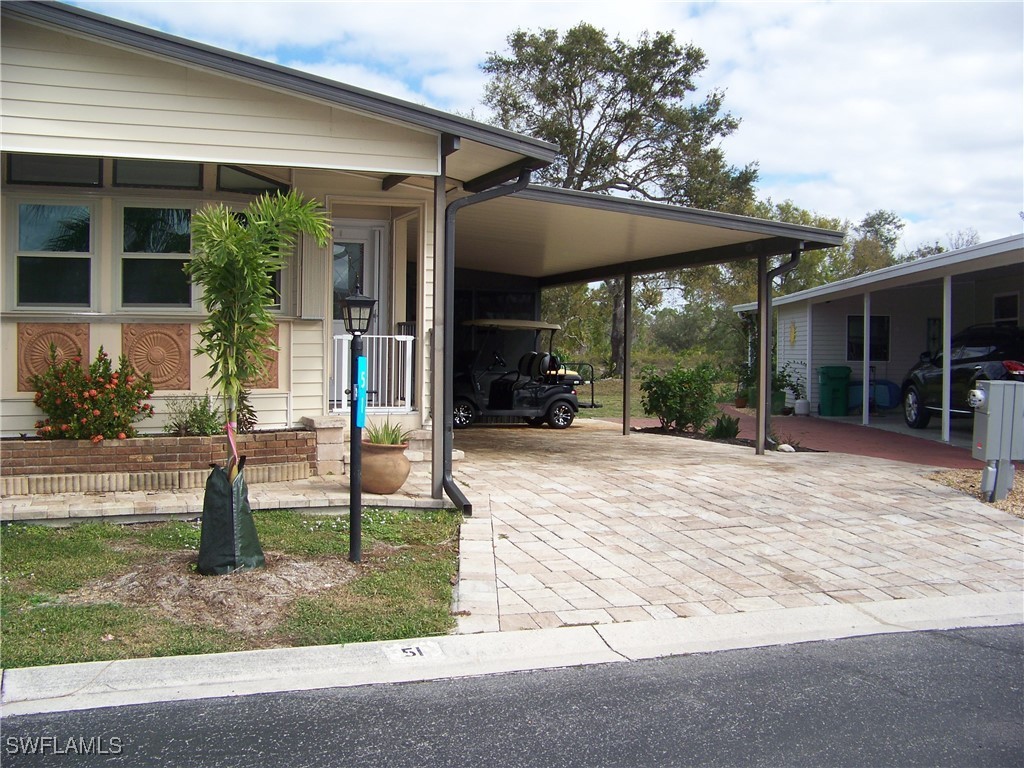 15550 Burnt Store Road, Unit 51 Punta Gorda, FL 33955 - Photo 2 of 50 front view of house with a yard