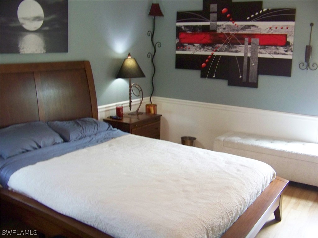 15550 Burnt Store Road, Unit 51 Punta Gorda, FL 33955 - Photo 27 of 50 a bed room with a bed and a night stand