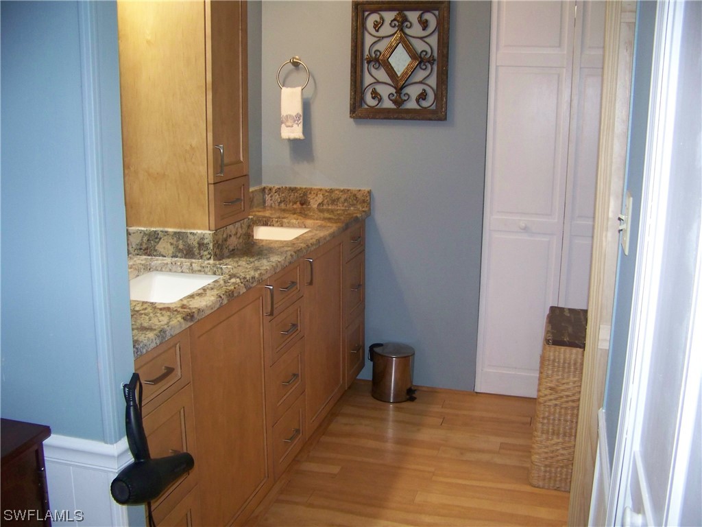 15550 Burnt Store Road, Unit 51 Punta Gorda, FL 33955 - Photo 29 of 50 a bathroom with a sink and a mirror