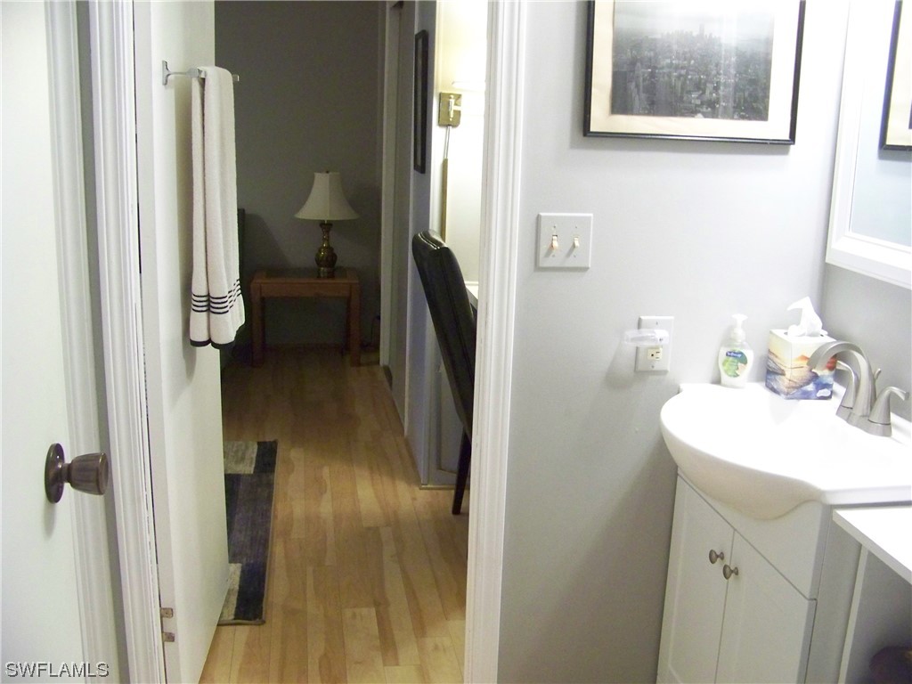 15550 Burnt Store Road, Unit 51 Punta Gorda, FL 33955 - Photo 36 of 50 a en suite bathroom with a sink and a mirror
