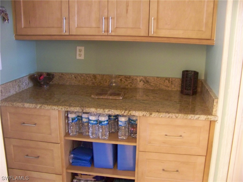 15550 Burnt Store Road, Unit 51 Punta Gorda, FL 33955 - Photo 39 of 50 a kitchen with a sink and cabinets
