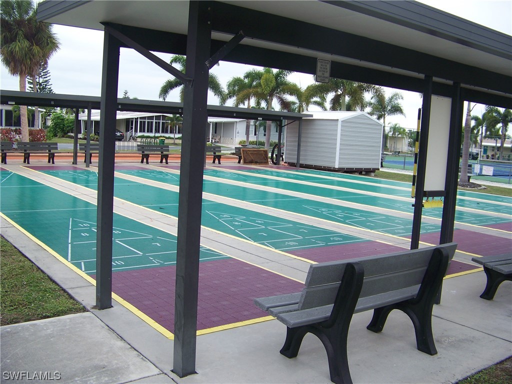 15550 Burnt Store Road, Unit 51 Punta Gorda, FL 33955 - Photo 47 of 50 a patio with table and chairs