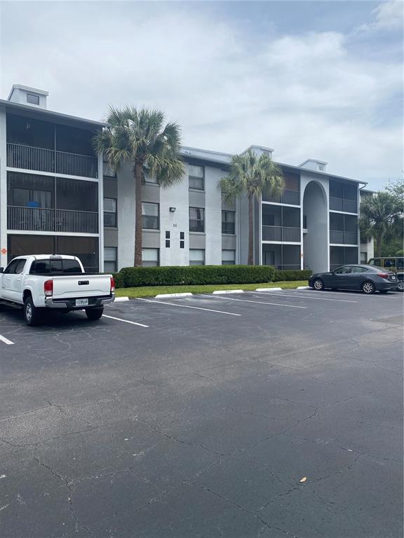 a view of street with parked cars