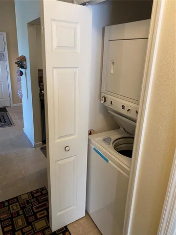 a bedroom with a bed and a lamp