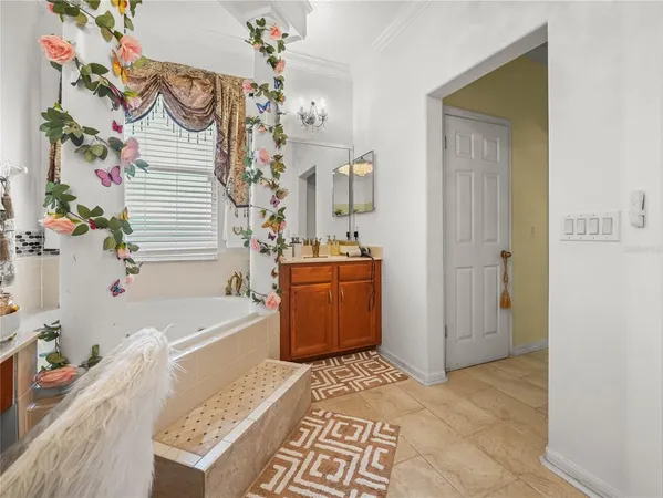 a view of a chair and tables in the patio next to a yard