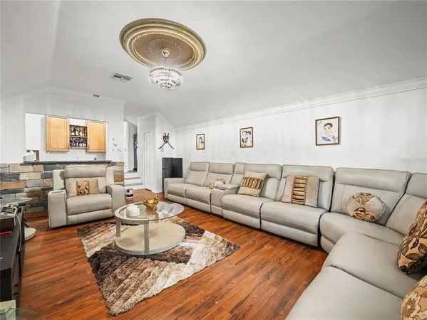 a bathroom with a granite countertop sink a mirror and a shower