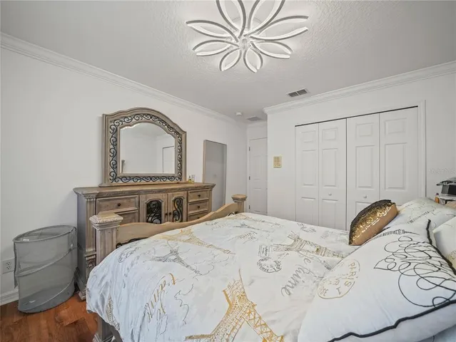 a living room with furniture and floor to ceiling windows