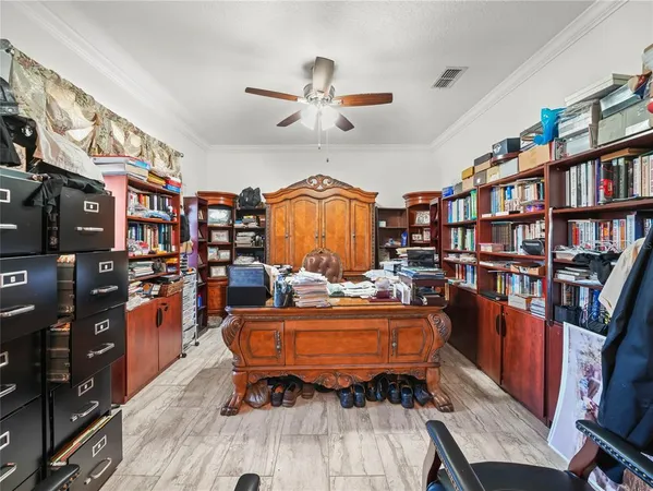 a reading room with furniture and a book shelf
