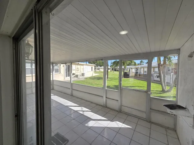 a view of a porch and garden