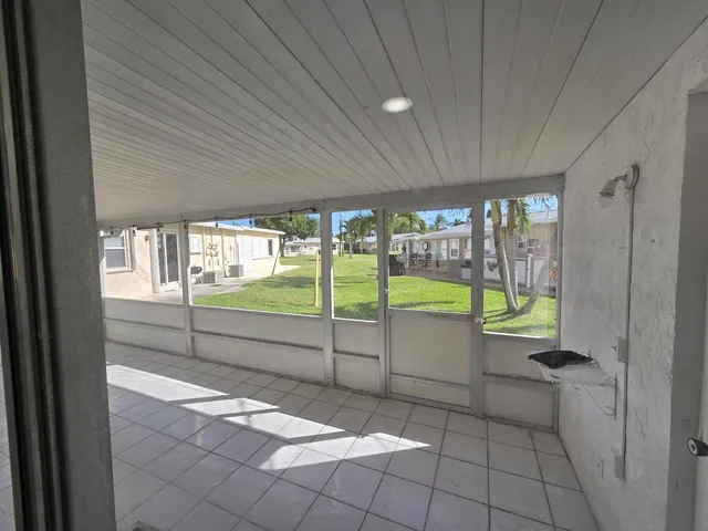 a view of a backyard with plants and a garden