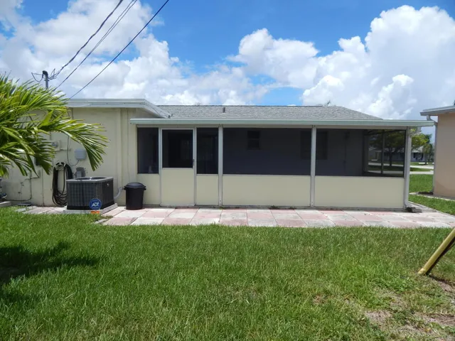 a view of a swimming pool with a terrace