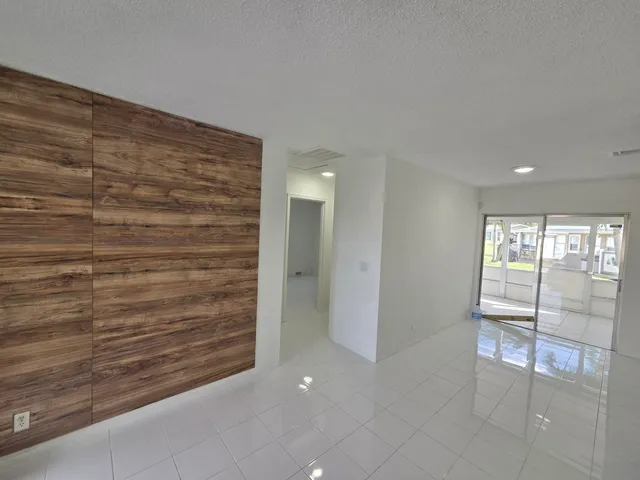 a view of entryway with an empty room and window