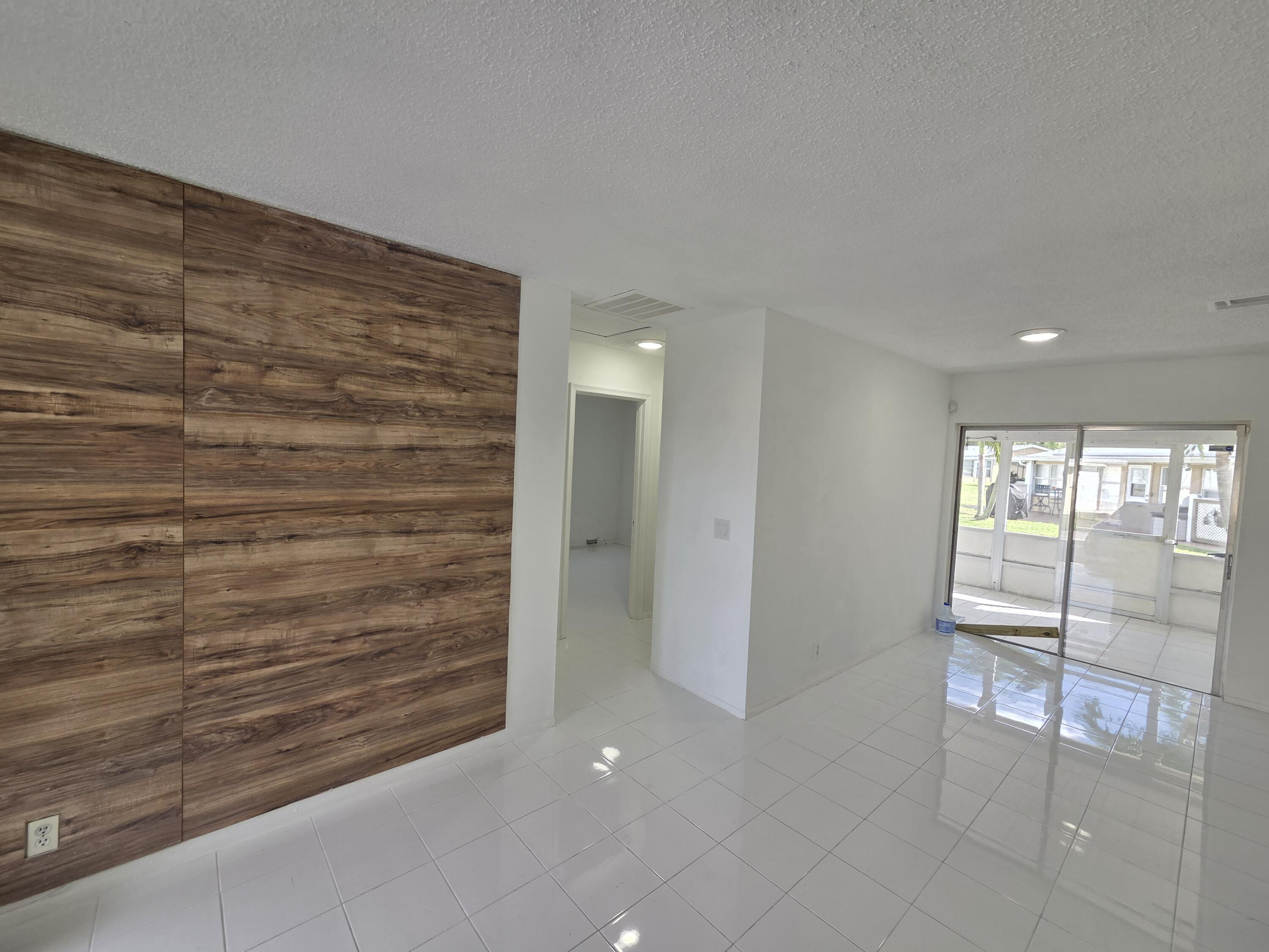 2847 Duke Lane Delray Beach, FL 33445 - Photo 2 of 17 a view of entryway with an empty room and window