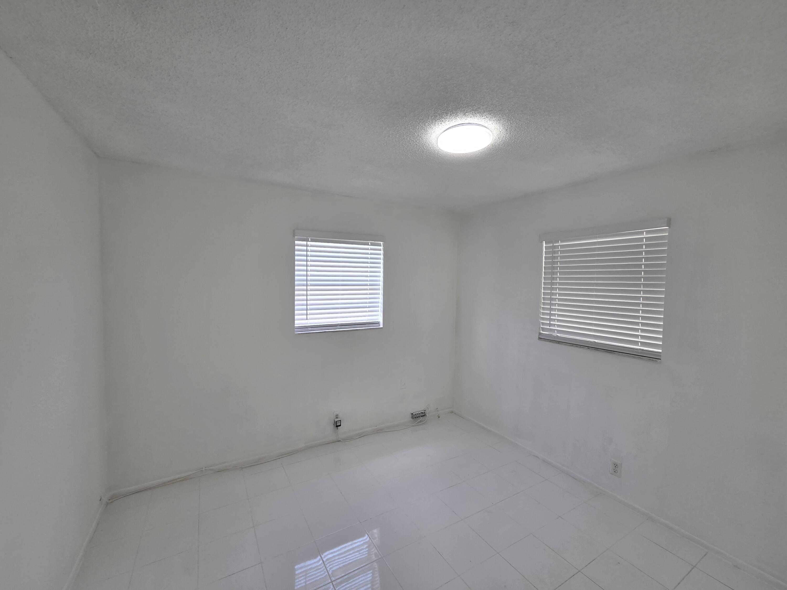 2847 Duke Lane Delray Beach, FL 33445 - Photo 5 of 17 an empty room with a window