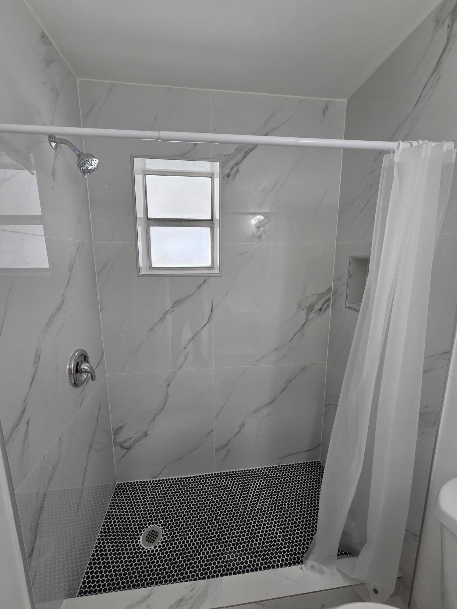 2847 Duke Lane Delray Beach, FL 33445 - Photo 9 of 17 a bathroom with a shower