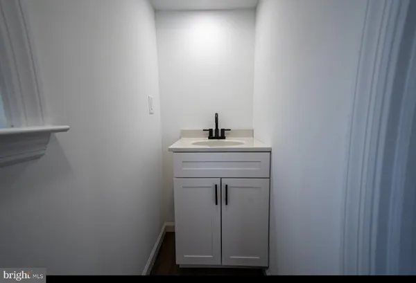 a bathroom with a sink toilet and vanity