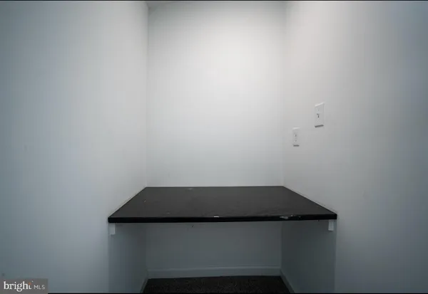 a bathroom with a bathtub and toilet