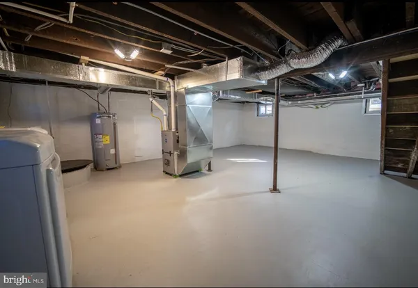 a view of empty room with wooden walls