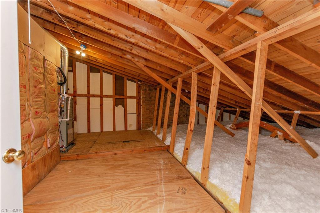 831 Trollinger Road Asheboro, NC 27203 - Photo 39 of 50 Ample walk-in attic storage. There's also additional attic space accessed by a pull-down door in the hallway.