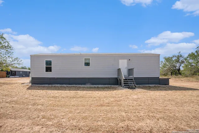 a view of a backyard of a house