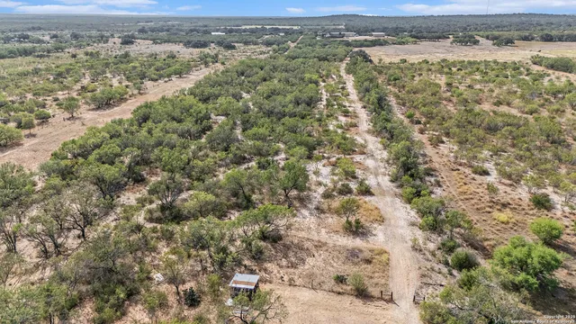 a view of a field with an ocean